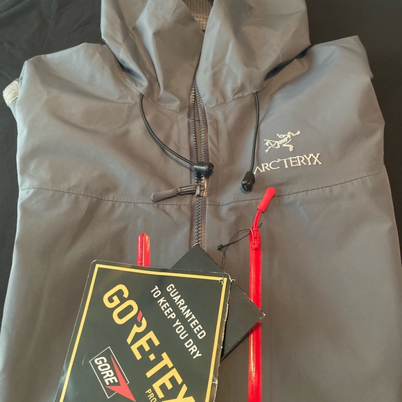 Arc'teryx Dark Gray Jacket with Bright Red Zippers - Picture 1 of 5